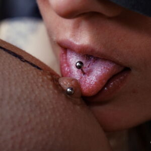 Vibrantly inked beauties Lucia and Iris indulge in intense sapphic games